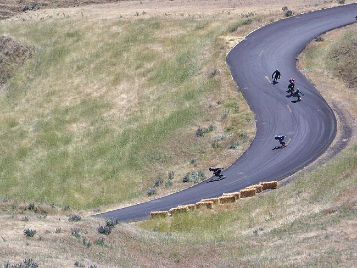 Nearly 300 men and 11 women showed up to skate Maryhill Loop Road near Goldendale, Washington recently. The skaters can reach speeds of about 50 miles per hour down the road’s 22 curves. Photo by Anna King